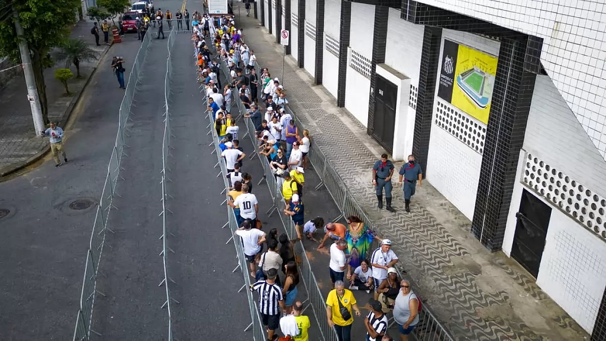 Fans line up outside the Vila Belmiro Stadium ahead of Pele's funeral in Santos.