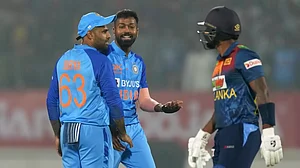 Hardik Pandya, centre, celebrates the wicket of Karunaratne with Suryakumar Yadav on Saturday.