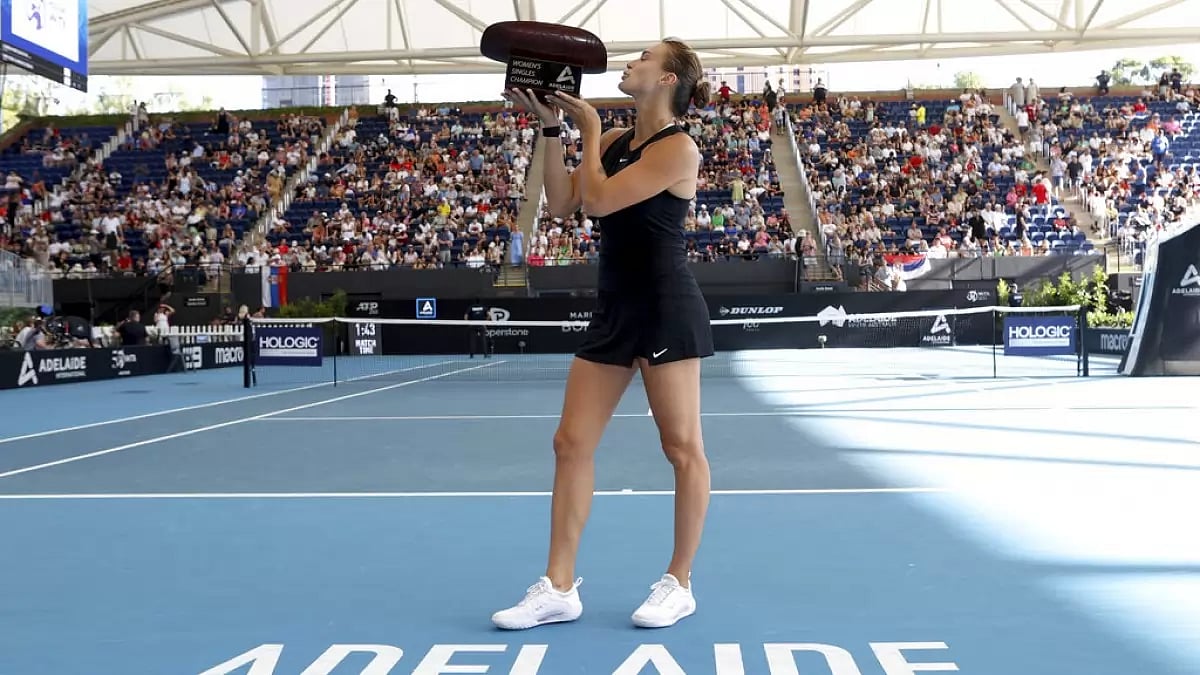 Sabalenka celebrates with the Adelaide International trophy after winning the final on Sunday.