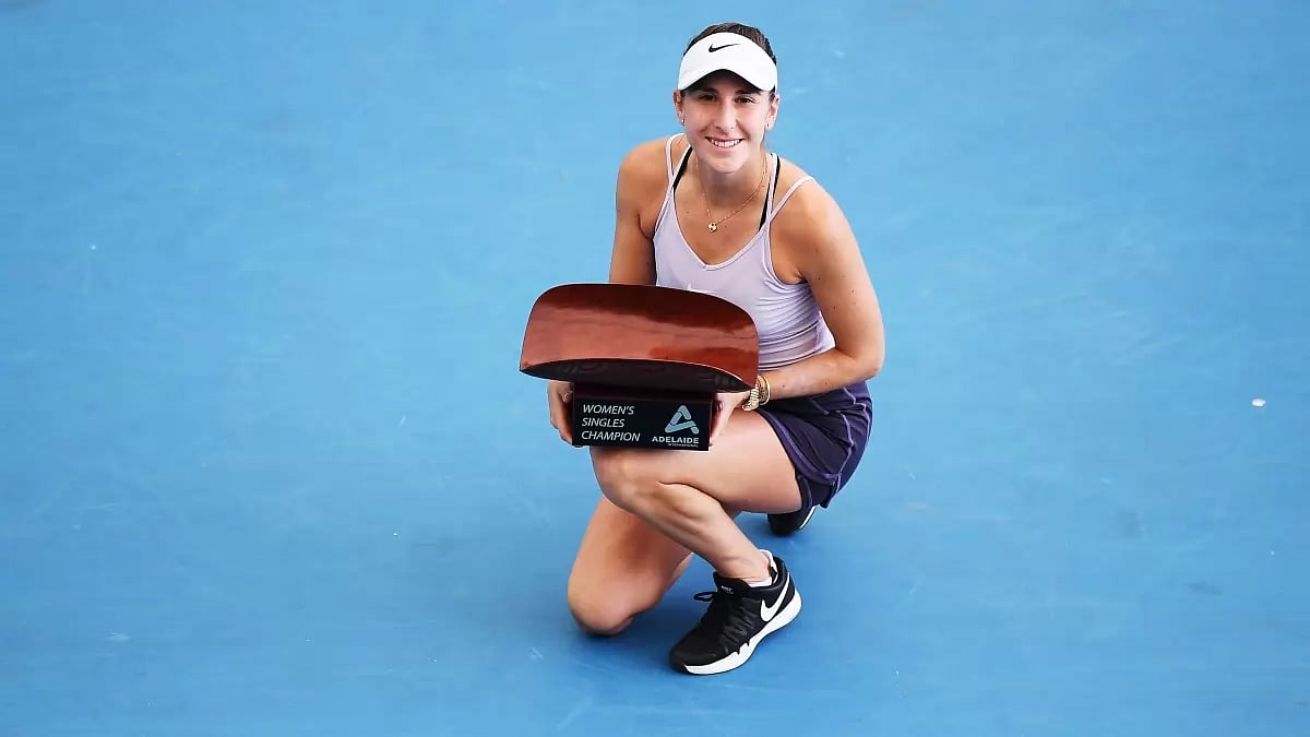 Belinda Bencic celebrates with the Adelaide International trophy on Saturday.