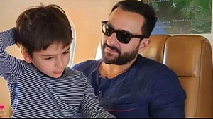 Taimur Ali Khan can be seen in the company of Saif Ali Khan within the confines of an airplane.