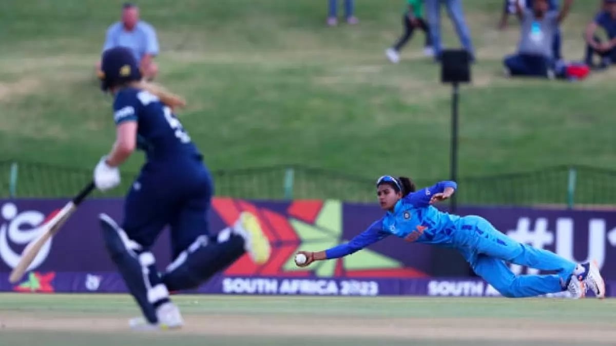 Archana Devi takes a one-handed diving catch to dismiss England's Ryana MacDonald-Gay on Sunday.