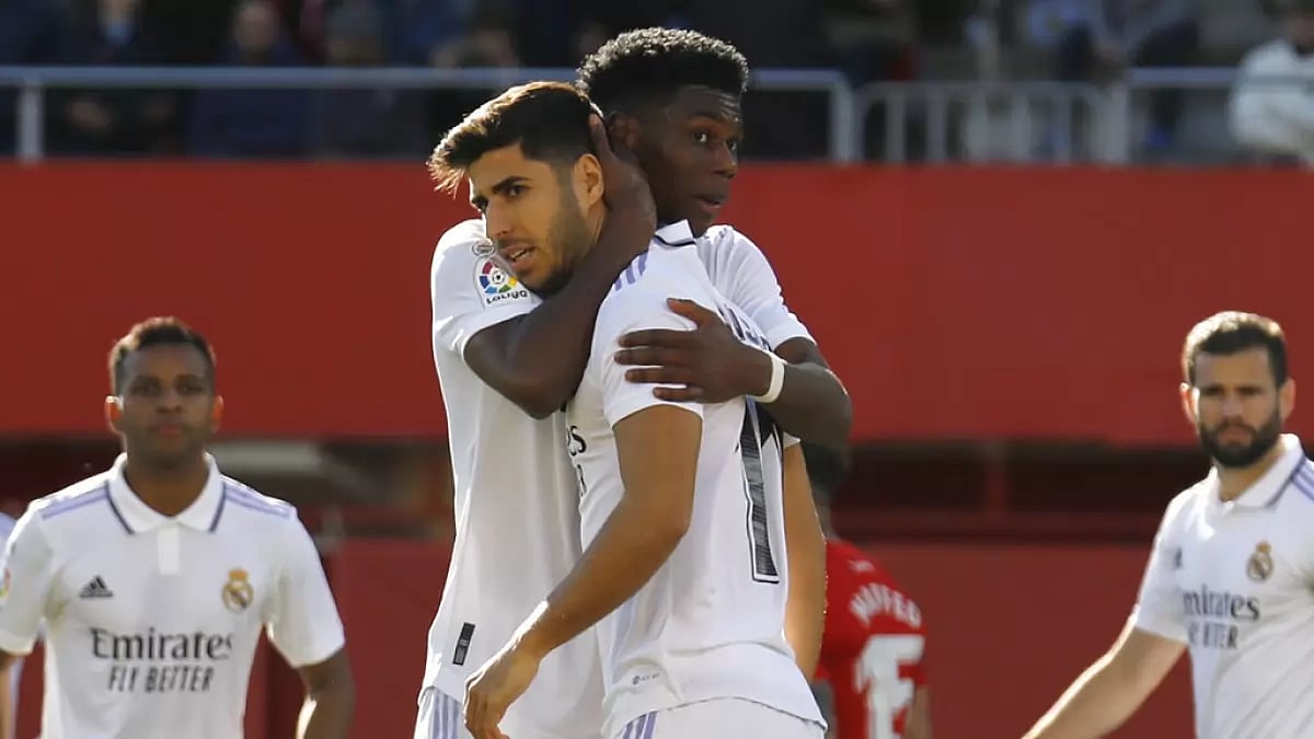 Aurelien Tchouameni comforts Asensio after the latter failed to convert a penalty kick on Sunday.