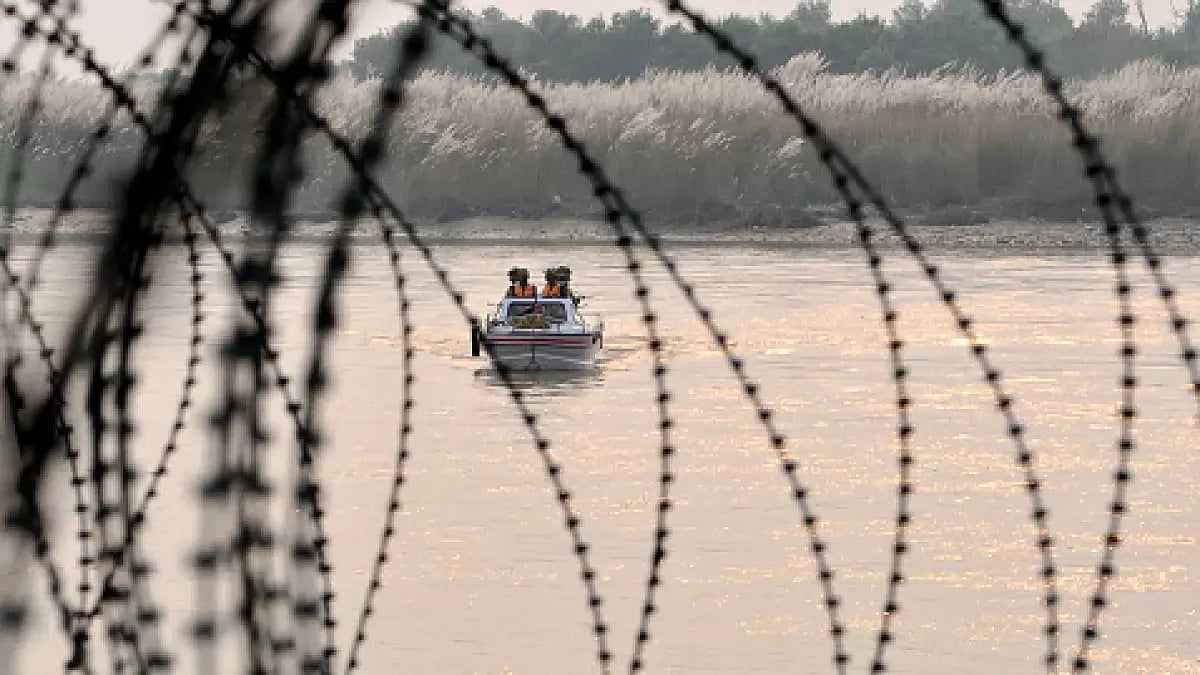 Security personnel patrolling in Chenab river, a tributary of river Indus