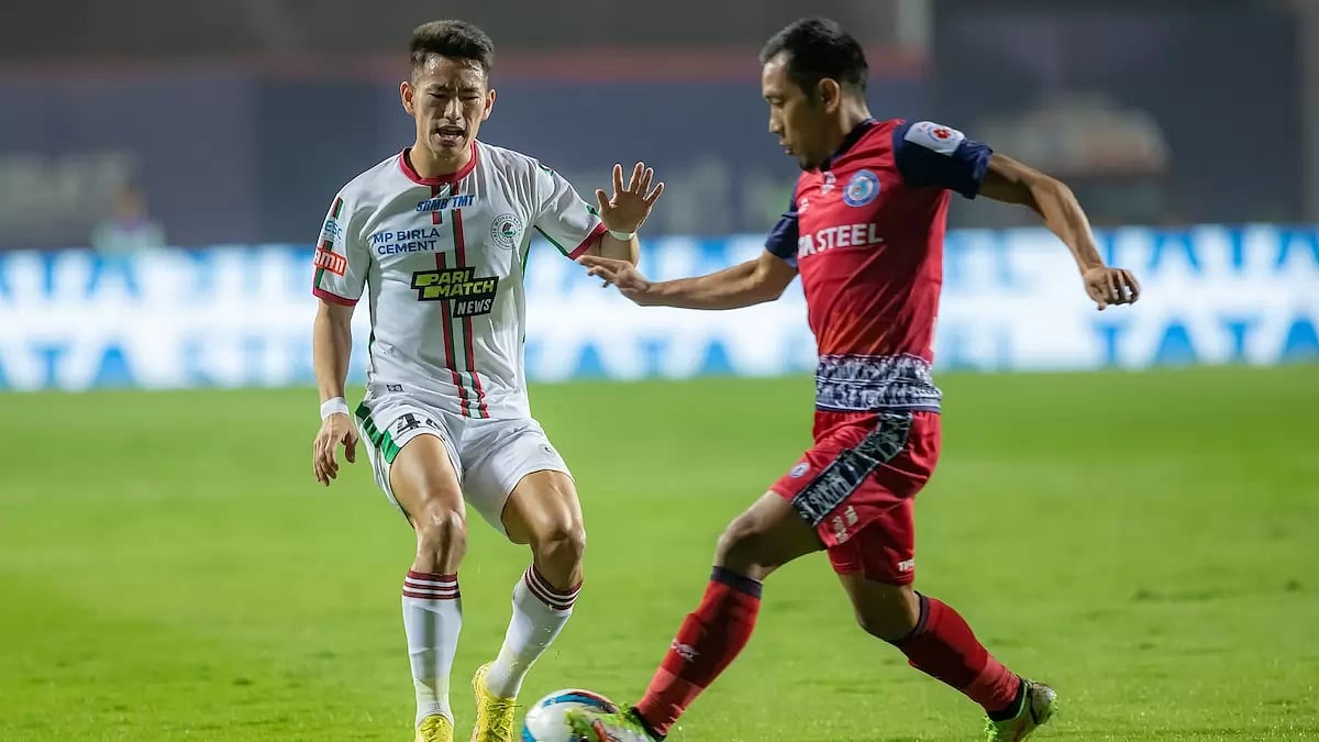 Ashish Rai of ATKMB, left, and Ricky Lallawmawma of JFC vie for the ball on Thursday.