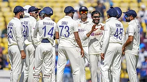 Indian players celebrate the wicket of Pat Cummins on Day 3 of the 1st Test in Nagpur.