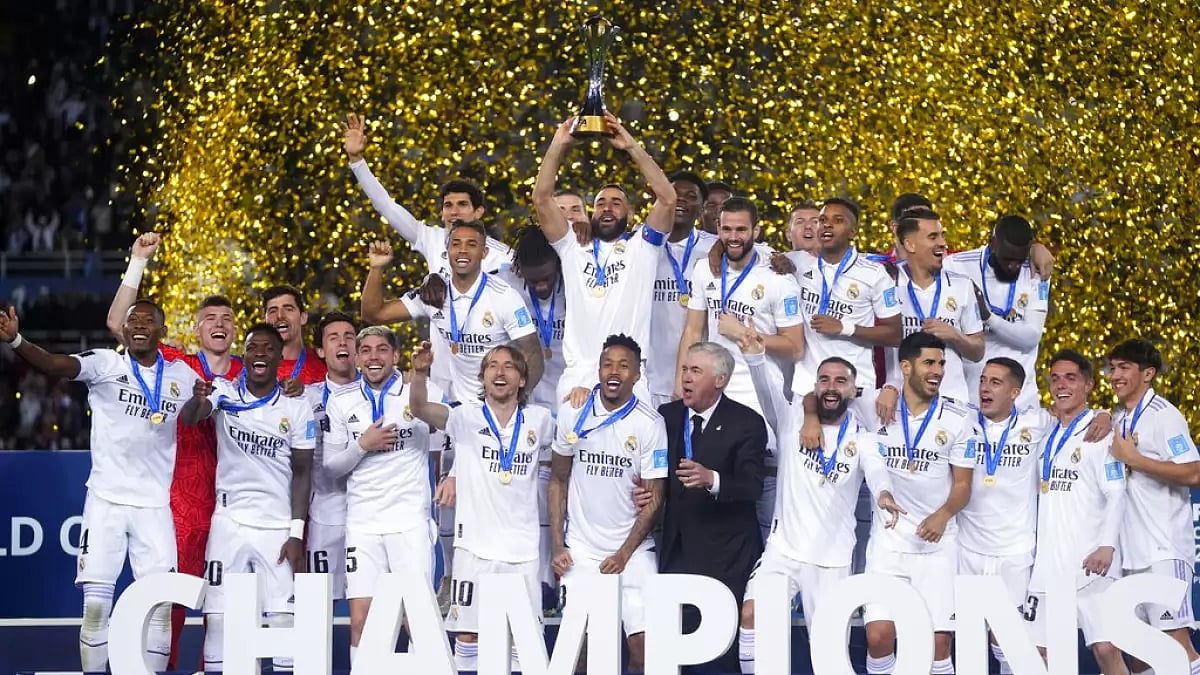 Real Madrid players celebrate with the trophy after defeating Al-Hilal on Saturday.