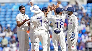 Team India players celebrate the wicket of Usman Khawaja on Day 3 of the 1st Test on Saturday.