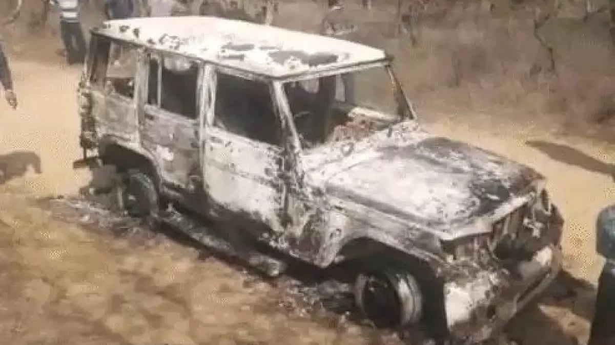 The charred vehicle that was recovered from the site. 