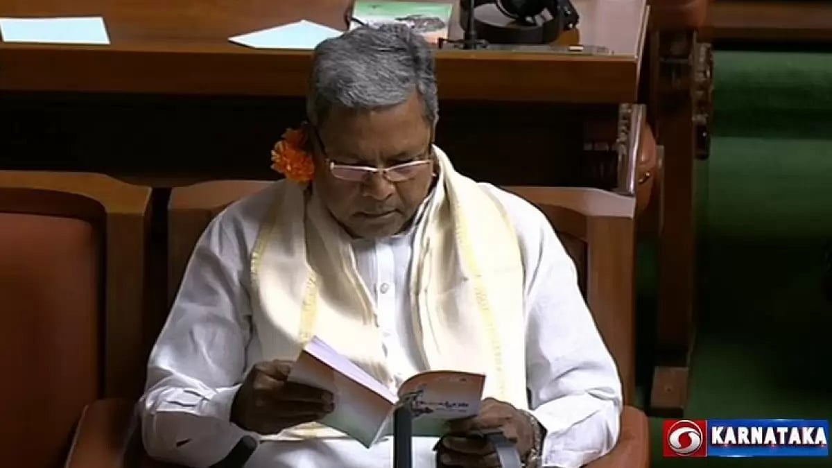 Karnataka Congress leaders wear flower in ear during budget presentation