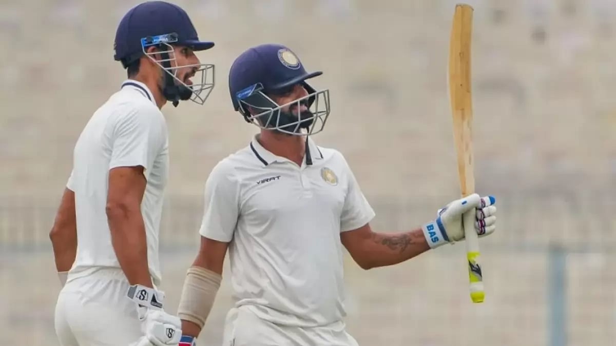 Vasavada, right, celebrates after reaching his fifty against Bengal on Friday.