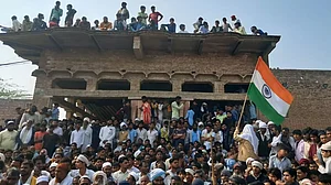A tricolor stand out, amidst a huge crowd gathered at Ghatmika after the charred bodies of Junaid &