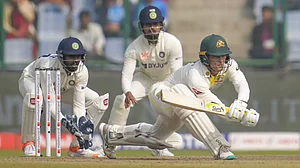 Alex Carey attempts a reverse sweep on Day 3 of the 2nd Test against India on Sunday.