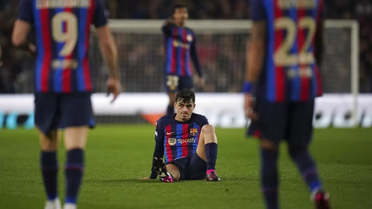 Pedri sits on the pitch after sustaining injury during his team's first leg match against United.