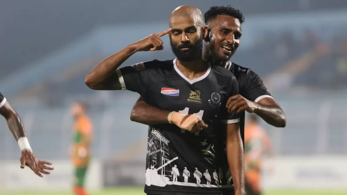 Kean Lewis, centre, celebrates after scoring his second goal against SDEC on Friday.
