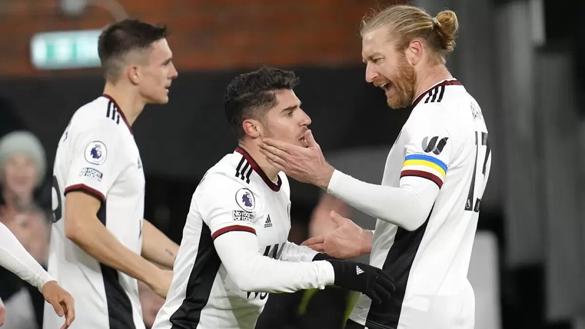 Solomon, centre, is congratulated by teammates after scoring a goal against Wolves on Friday.