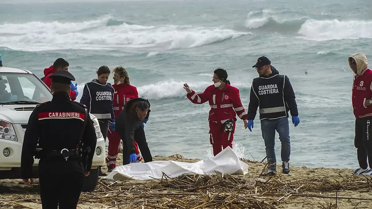 A wooden boat broke up in stormy seas on the reefs near the Calabrian coast