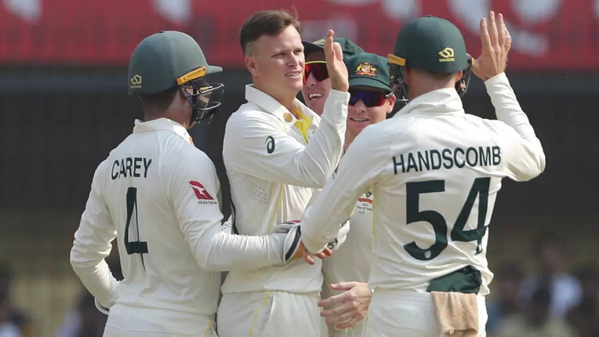 Kuhnemann, centre, celebrates the wicket of Rohit Sharma on Day 1 of the 3rd Test on Wednesday.