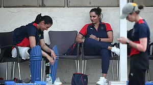 Sania Mirza, centre, interacts with Smriti Mandhana during RCB's training camp.