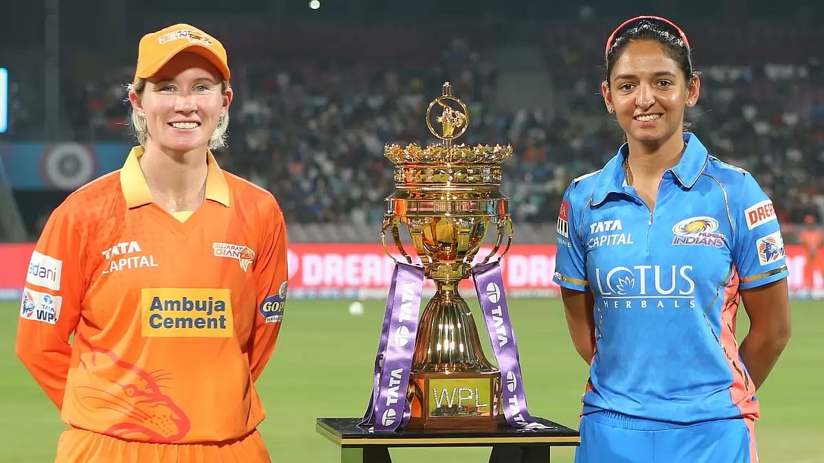 Mooney and Harmanpreet pose with the trophy before the opening game of WPL on Saturday.