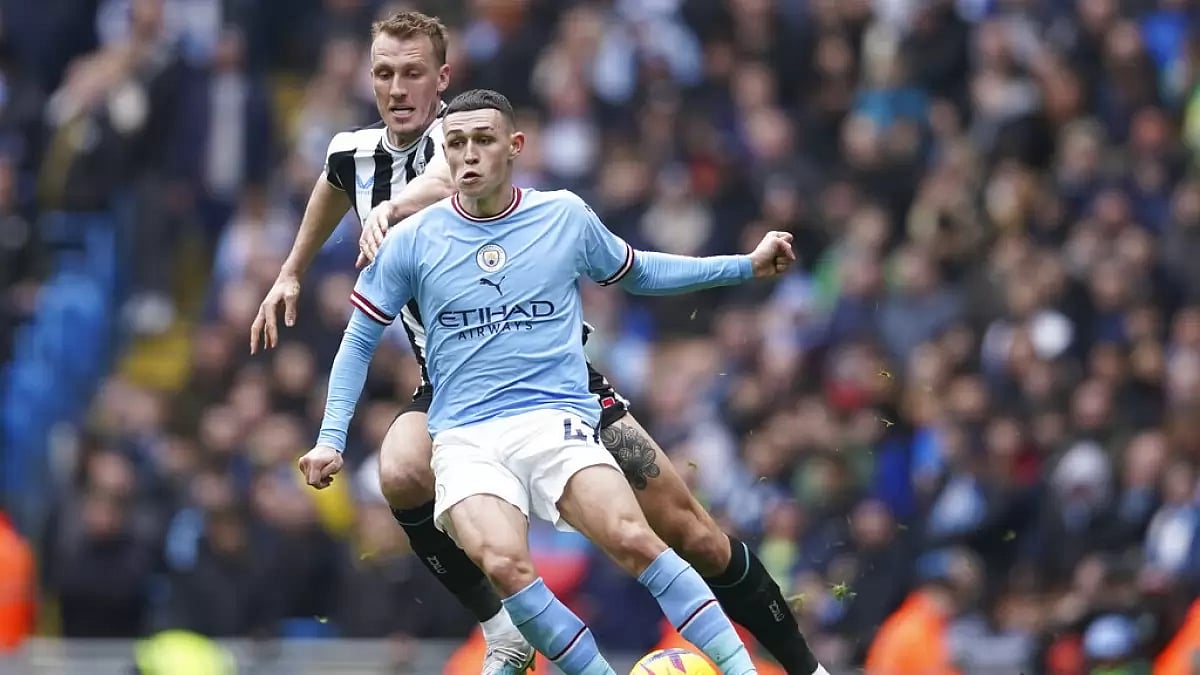 Foden controls the ball against Newcastle's Dan Burn on Saturday.