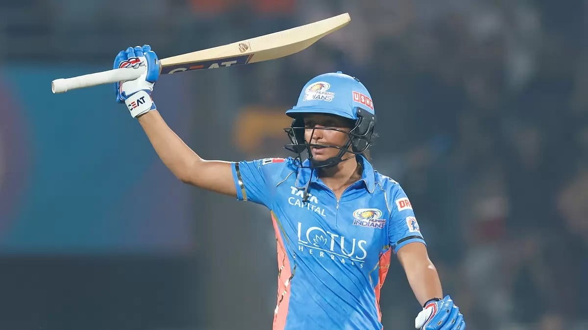 Harmanpreet raises her bat after reaching fifty against Gujarat Giants on Saturday.
