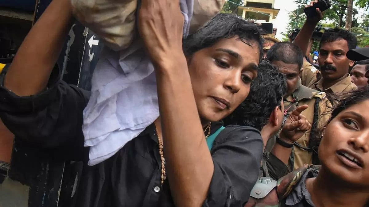 Activist Rehna Fathima being escorted by police to Sabarimala temple