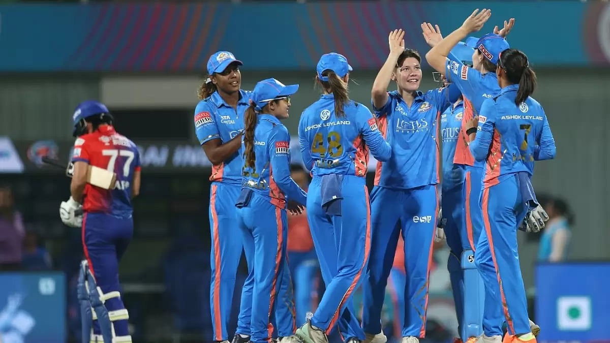 MI players celebrate the wicket of Marizanne Kapp after being bowled by Issy Wong on Thursday.