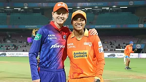 Captains Meg Lanning and Sneh Rana pose for a picture ahead of their teams' match on Saturday.