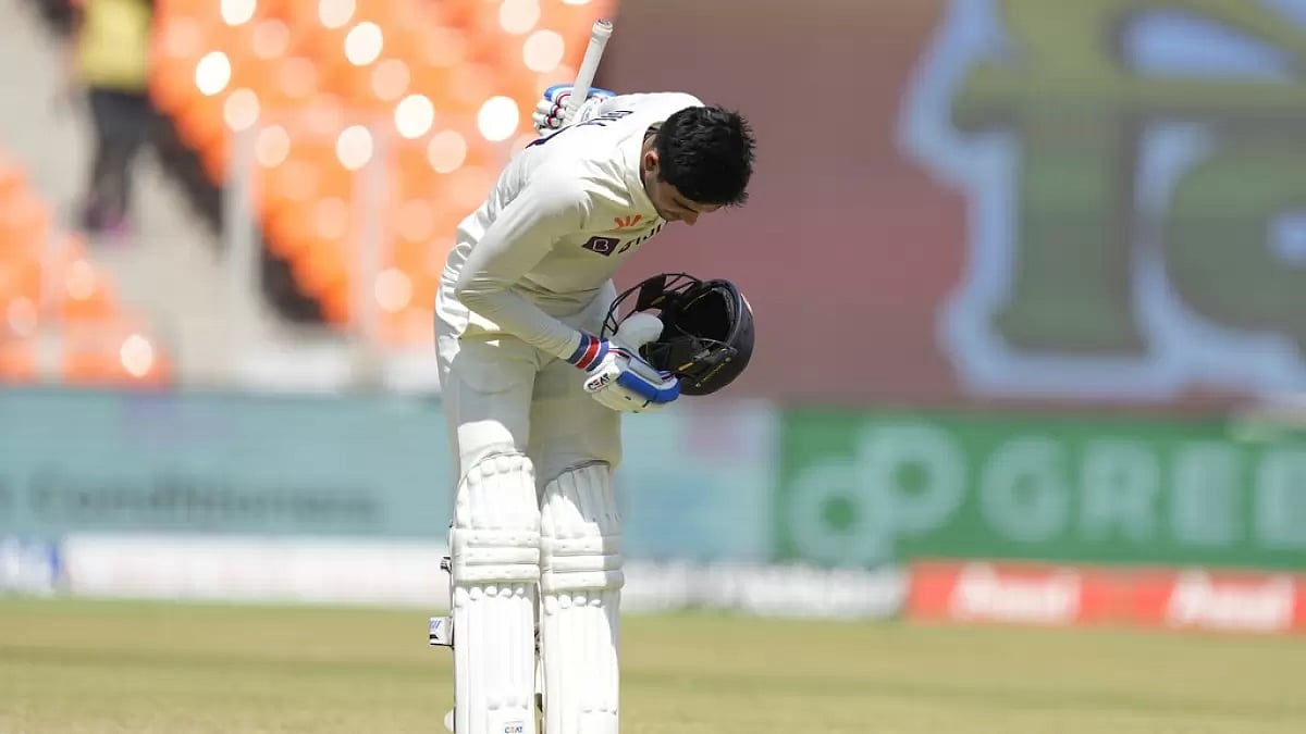 Gill celebrates with his traditional bowing gesture after reaching hundred on Saturday.