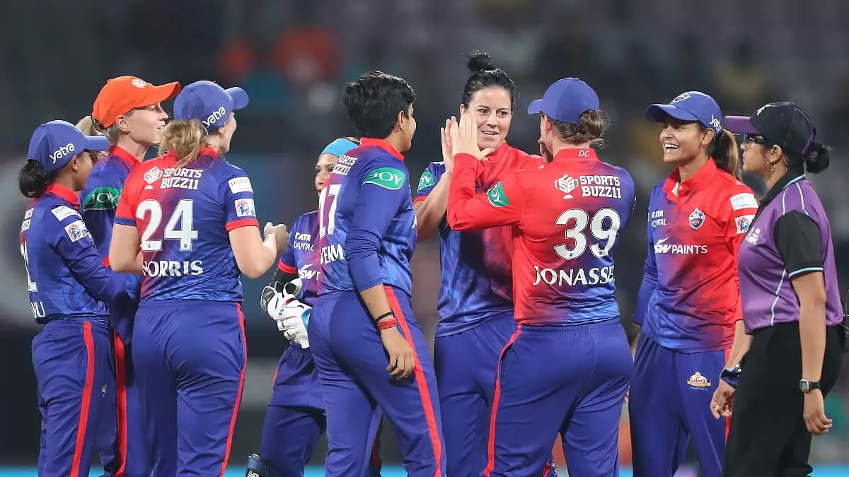 Kapp, centre, celebrates the wicket of Sabbhineni Meghana with her teammates on Saturday.