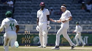 Gerald Coetzee celebrates after dismissing Jason Holder on Day 4 of the 2nd Test on Saturday.