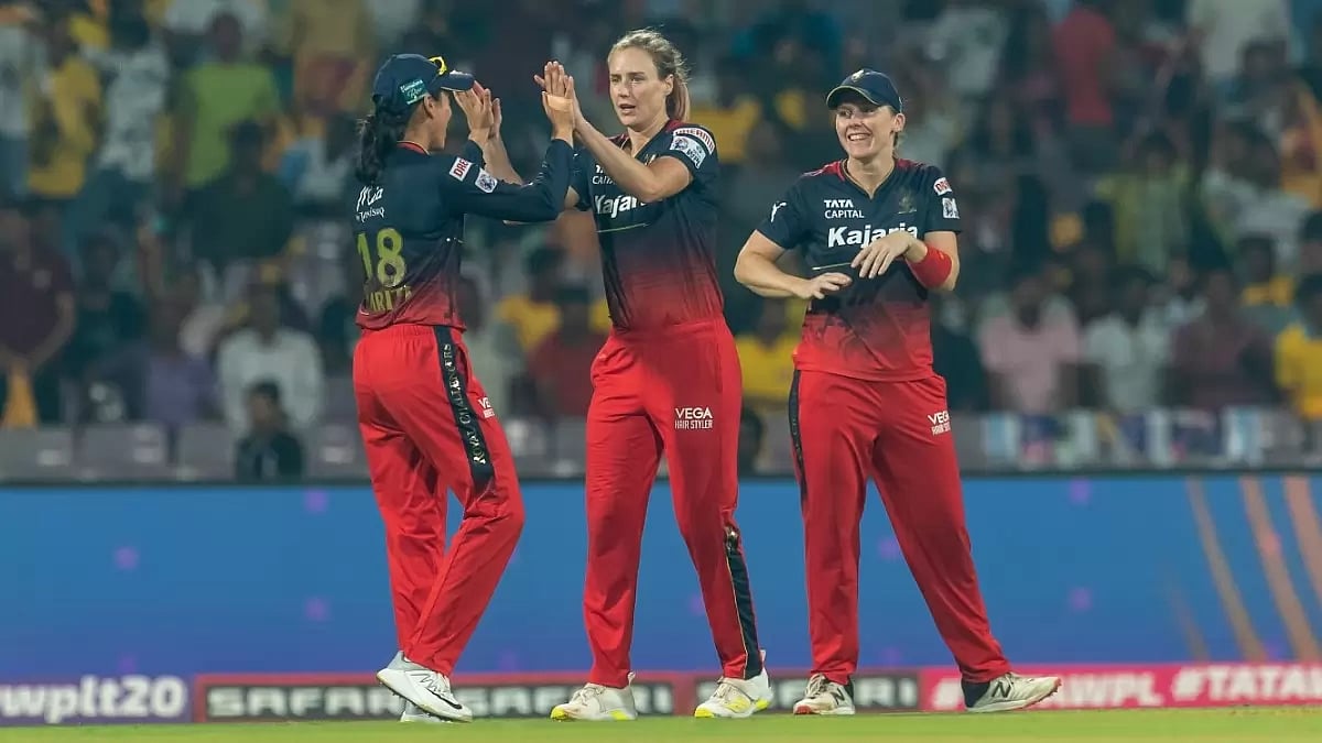 Perry, centre, celebrates the wicket of Grace Harris with her teammates on Wednesday.