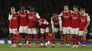 Arsenal players react after their ouster from the Europa League on Thursday.