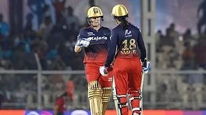 (Photo: File) : Women's Premier League: Sophie Devine, left, and Smriti Mandhana, right, in action during WPL 2023