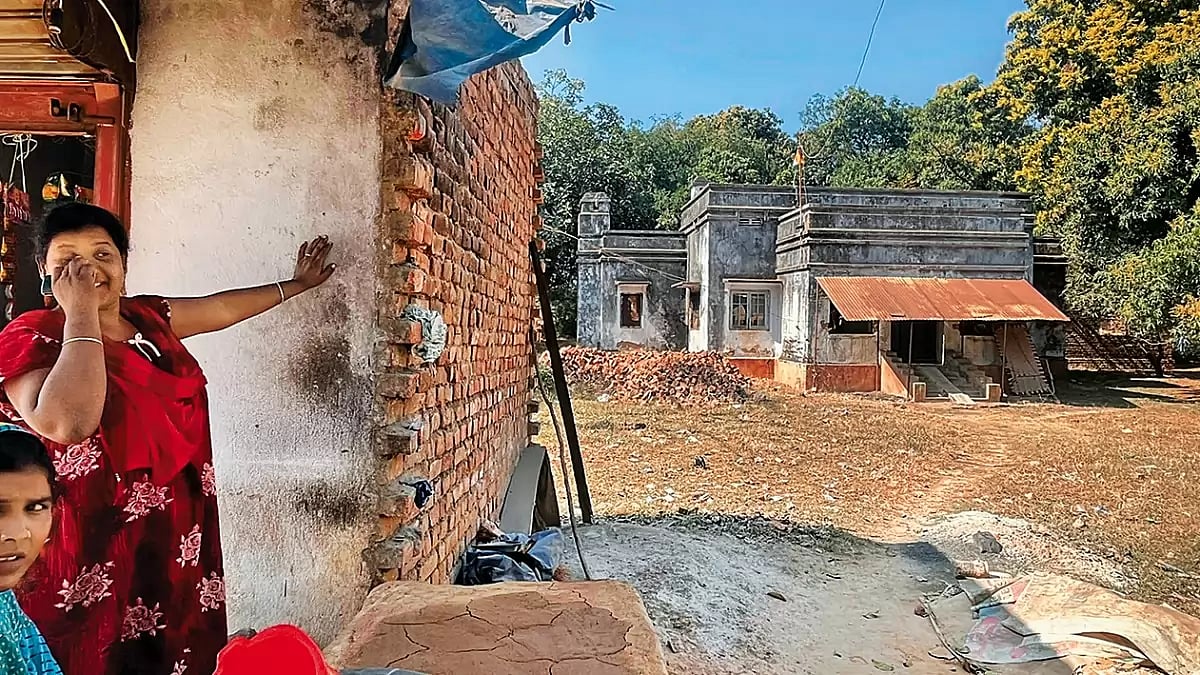 Of Better Days  An old colonial bungalow seen in the picture is owned by the church. It is now in ruins. Damyanti (in red), who runs a small tea stall by the road, and a school teacher now live in the bungalow