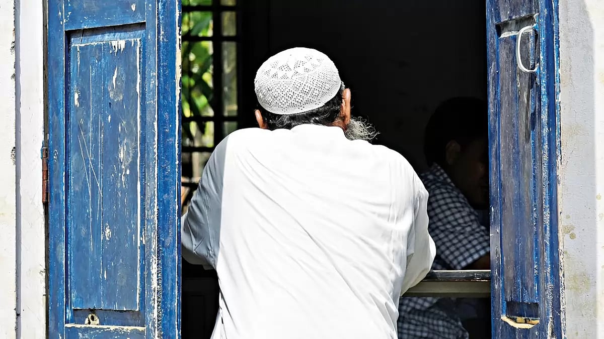 In or Out: Morigaon disrict of Assam, August 2019: a man checks for his name in the final published list of the NRC   - null