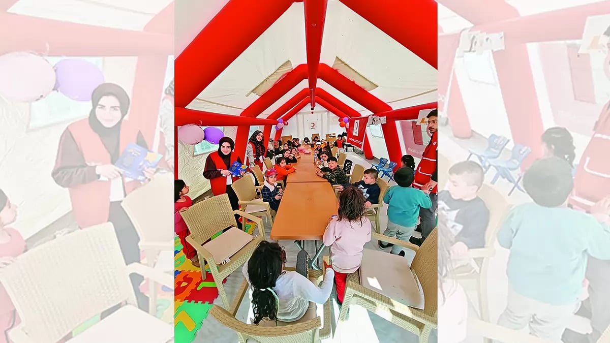 Home For Two Weeks: Children engaged in activities by therapists and other professionals at the tent of the Turkish Red Crescent, Egricay stadium