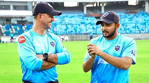 Ponting, left, interacts with Prithvi Shaw during a team practice session on Thursday.