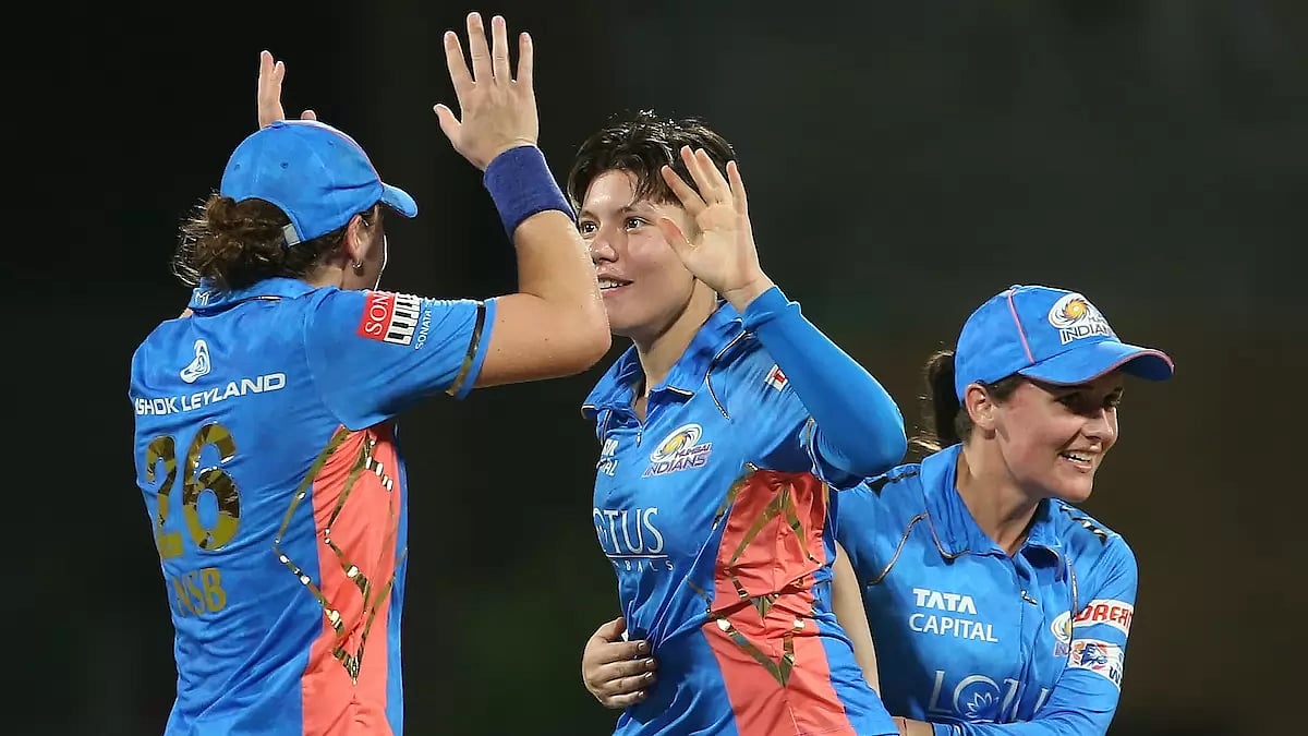 Issy Wong, centre, celebrates the wicket of Alyssa Healy with Sciver-Brunt and Kerr on Friday.