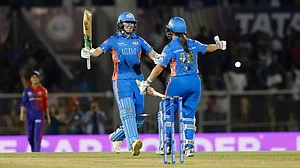 Sciver-Brunt celebrates with Amelia Kerr after scoring the winning runs against DC on Sunday.