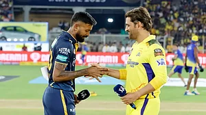 Hardik Pandya and MS Dhoni shake hands during the toss.