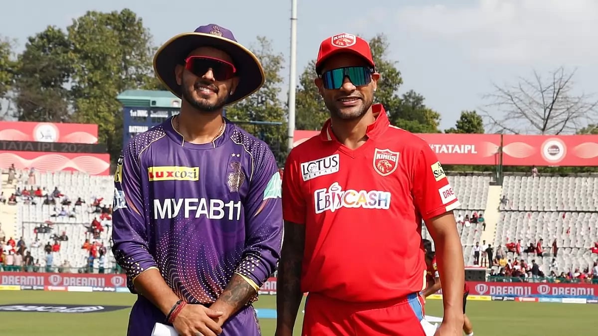 Nitish Rana, captain of KKR, and Shikhar Dhawan, leading PK, at the toss on Saturday.