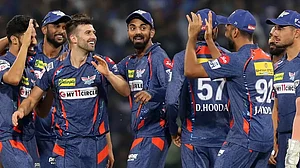 Mark Wood, third left, celebrates his fifth wicket against DC on Friday.