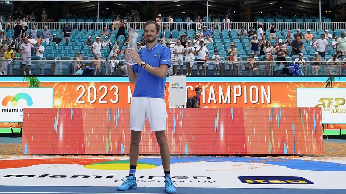 Daniil Medvedev poses with his trophy after beating Jannik Sinner in the final.