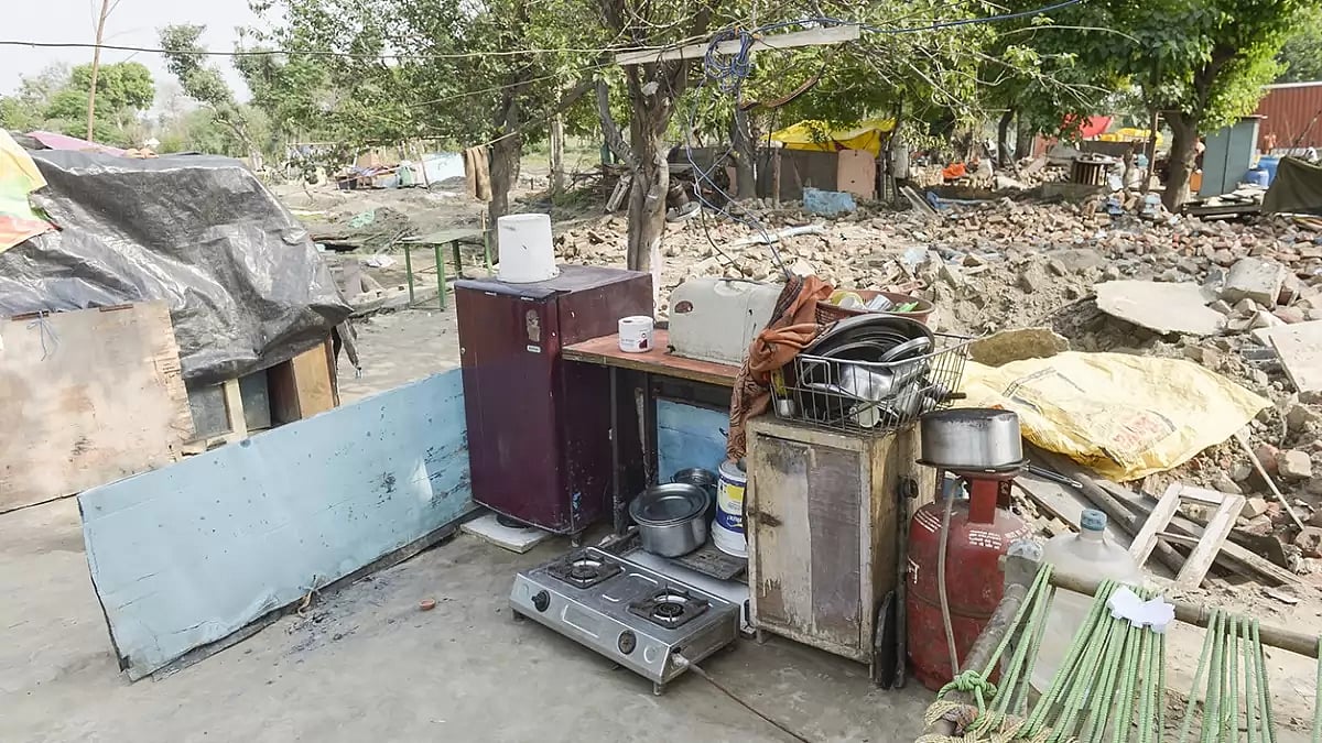 Residents of Moolchand Colony in Bela Estate on the banks of the Yamuna river in Delhi live among the ruins of their houses surrounded by their meagre belongings after they were evicted and their houses demolished in the name of G 20 beautification.