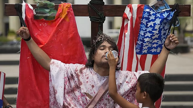 Protestors March In Philippines To Mark The Beginning of Holy Week