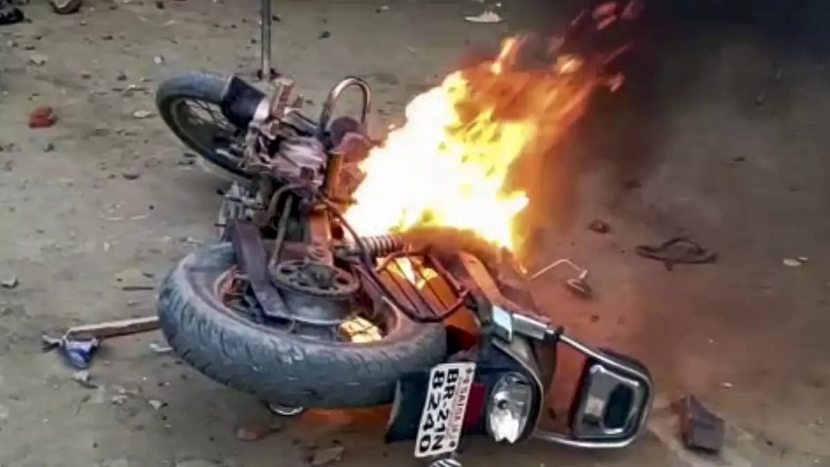 A vehicle set on fire during Ram Navami clashes in Bihar's Nalanda