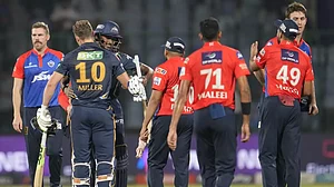 DC players exchange commiserations as GT batters celebrate their win on Tuesday.