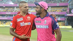 Shikhar Dhawan and Sanju Samson interact during the toss ahead of their match on Wednesday.